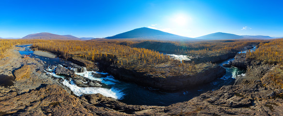 Fototapeta na wymiar Aerial panorama of the autumn mountains landscape. Waterfall in the National park Putorana in Siberia. Nature and ecology concept.