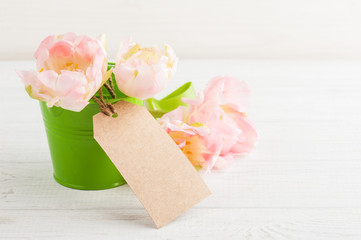 Pink spring tulips with blank tag