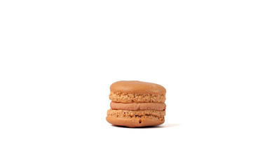Tasty brown macaron isolated on white