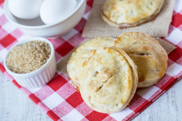 Autumn Apple Hand Pies with Raw Sugar and Eggs Close