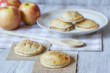 Red Apples And Hand Pies with Wood Spoon