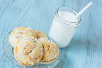 Close Up Small Apple Hand Pies With Milk
