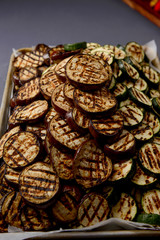 Grilled pieces of eggplants on grey background