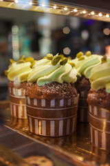 Chocolate cupcake with milk cream of pistachio