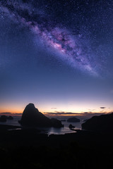 beautiful milky way galaxy with colorful stars and starlight on night sky over island mountain