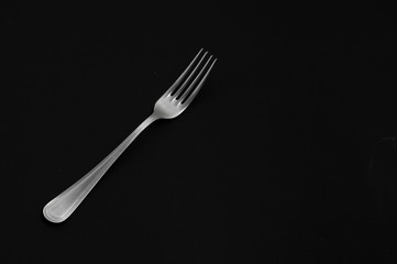 fork on a black background