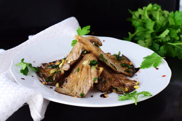 Grilled oyster mushrooms with balsamic glace on a white plate. Healthy eating concept. Vegetarian food. Dieting. Fasting