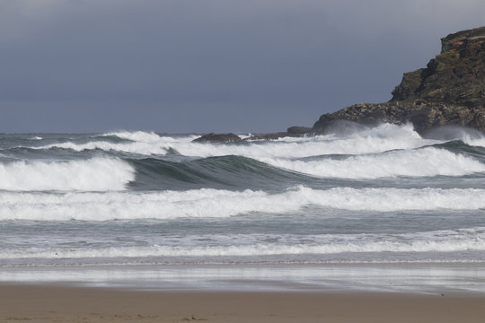 Background image of strong swell in a storm at the beach.