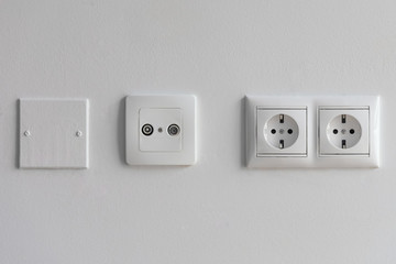 white sockets on a white wall