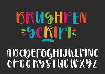 Obraz premium White and colored capital handwritten vector brush pen alphabet on black background.
