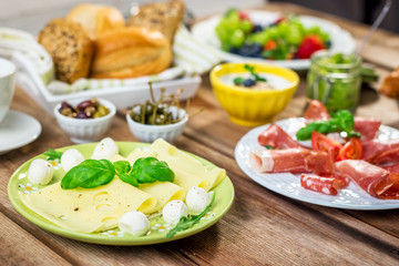 Breakfast served with, cheese, sausage, fruit, croissants