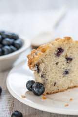Blueberry Muffin Cut In Half With Wooden Spoon