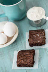 Brownies Sweet Treats with Eggs and Flour and a Coffee Cup