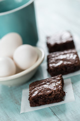 Three Brownies With Eggs and Coffee Cup
