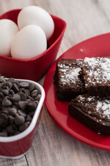 A Plate of Brownies With Chocolate Chips and Eggs