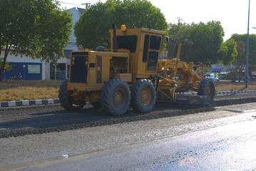 Fototapeta premium Motor grader doing road