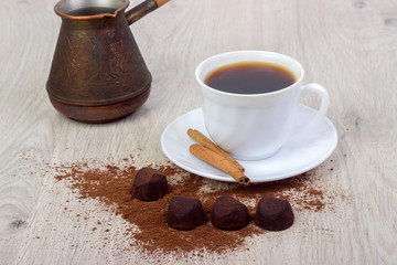 Dessert cocoa truffle, cinnamon and a cup of coffee