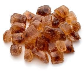 Brown caramelized lump cane sugar cube isolated on white background cutout