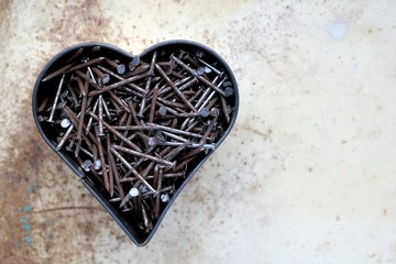valentines day picture, heart with rusted nails. Vintage background with copy space