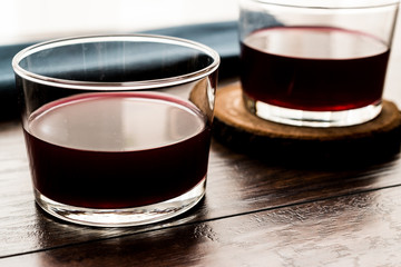 Red wine in short glass.