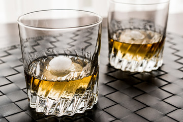 Glass of whiskey with ice