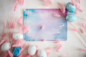 Easter mock up with fluffy flowers, eggs and watercolor abstract painting with space for text