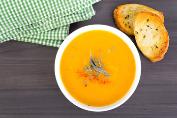 vegetable cream soup bowl on table