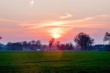 sunset in Europe Germany with a green field