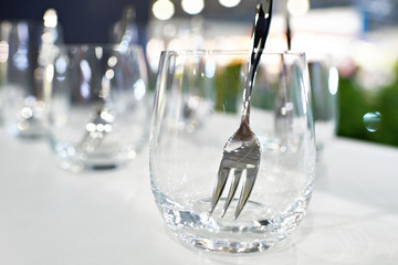 Glass with fork in cafe