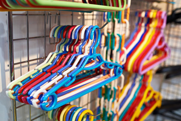 Сolored plastic hangers in hardware store