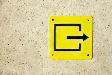 Yellow sign evacuation pointer exit right