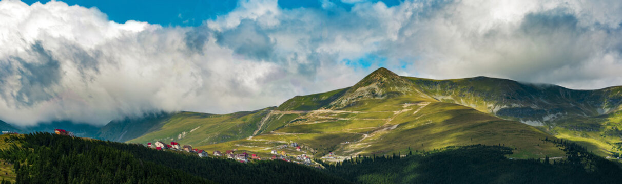 Panoramic view of Papusa Peak in Parang Mountains seen from Ranca sky resort  , Romania