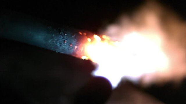 Slow motion of flame from torch heating up piece of metal