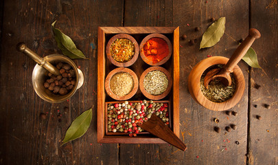 Species and herbs on wooden table