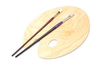 Wooden paint palette and brushes