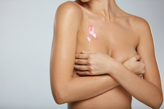Naked Woman With Breast Cancer Awareness Ribbon On Chest