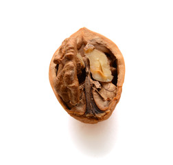 Half of a cracked walnut isolated on white background