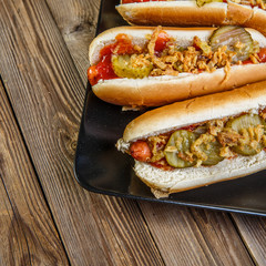 American hot dog with pickles,onions, ketchup and mustard