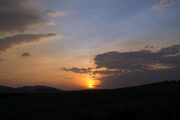 Sunset on meadow with hills and tree. Slovakia