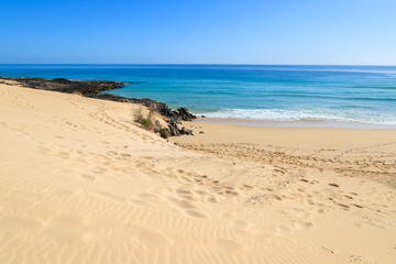 View of sand dunes and ocean in Corralejo National Park, Fuerteventura, Canary Islands, Spain
