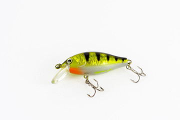 Exhibition of pirated copies of fishing metal spoon baits. Bait for fishing in the shape of a spoon with a hook on a white background