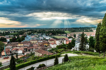 Fototapeta na wymiar Evening storm over the medieval village