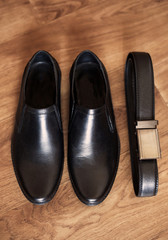 Mens set of black leather shoes and belt