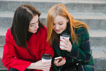 Two girls with gadget