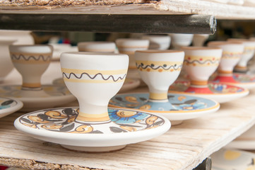Closeup view of some decorated ceramic egg cups in a workshop of Caltagirone, Sicily
