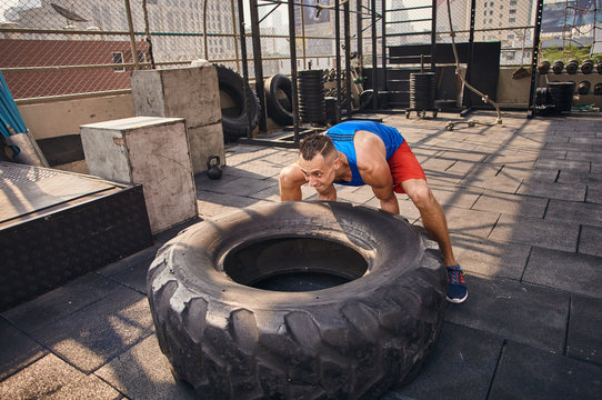 Workout with tire - Powered by Adobe