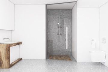 Bathroom with a white wall and a glass door