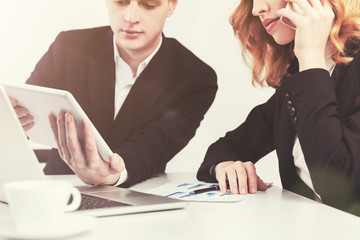 Man and woman looking at tablet