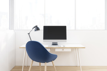 Workplace with a blue chair, close up
