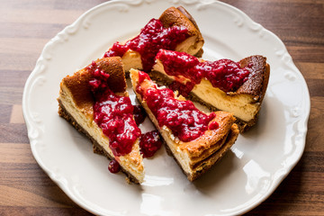 Homemade Raspberry Cheesecake in white plate